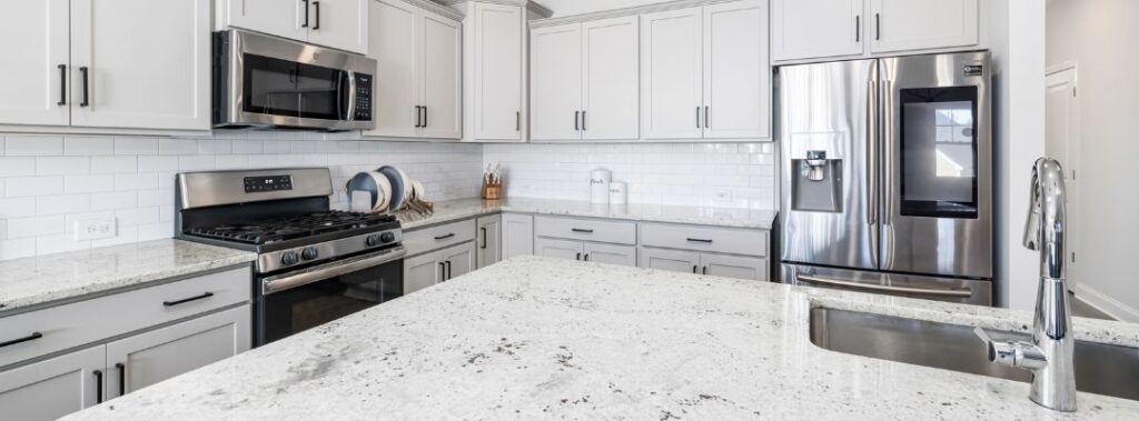 Light neutral granite countertop colors in a modern luxury kitchen