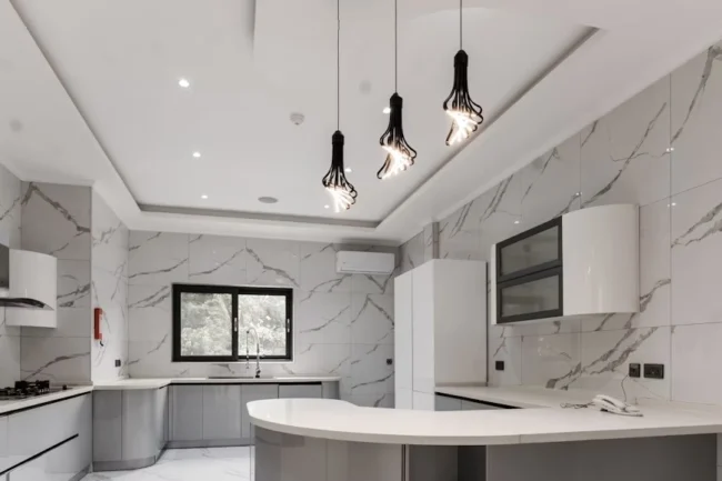 Modern kitchen with elegant Granite Quartz Countertops showcasing a polished finish and premium design.