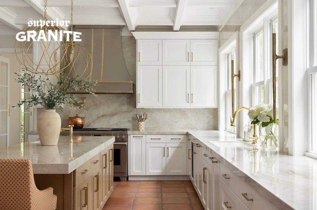 A white kitchen features elegant stone surfaces, showing how a high-quality Countertop Lasts Longer in Florida.