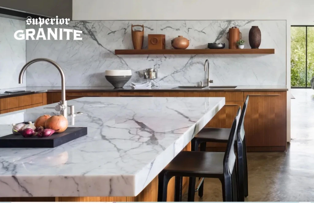 Elegant kitchen with white veined counters and backsplash where Superior Granite Is Worth Money.
