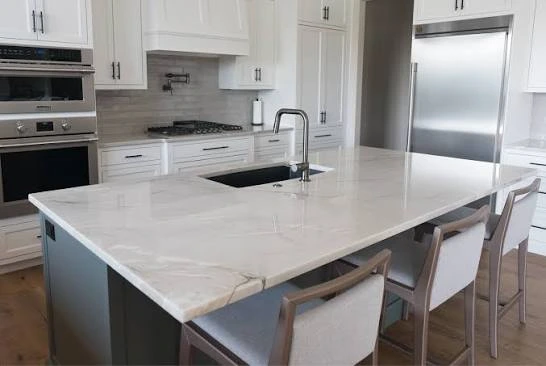 Elegant kitchen interior designed with Azzurra Bay Quartzite surfaces.