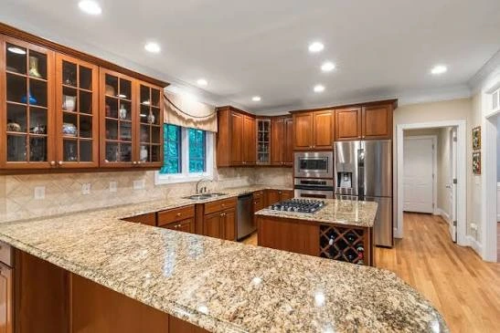 A modern wooden kitchen setup for homeowners shopping for new countertops.