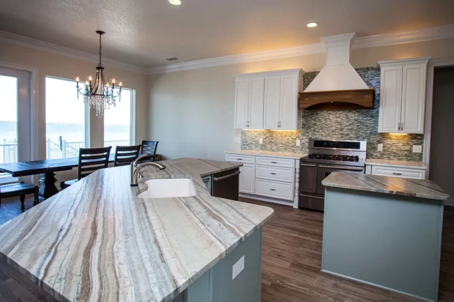 Modern kitchen with stone island featured in Keep Your Counters Looking New. Modern kitchen with stone island featured in Keep Your Counters Looking New.