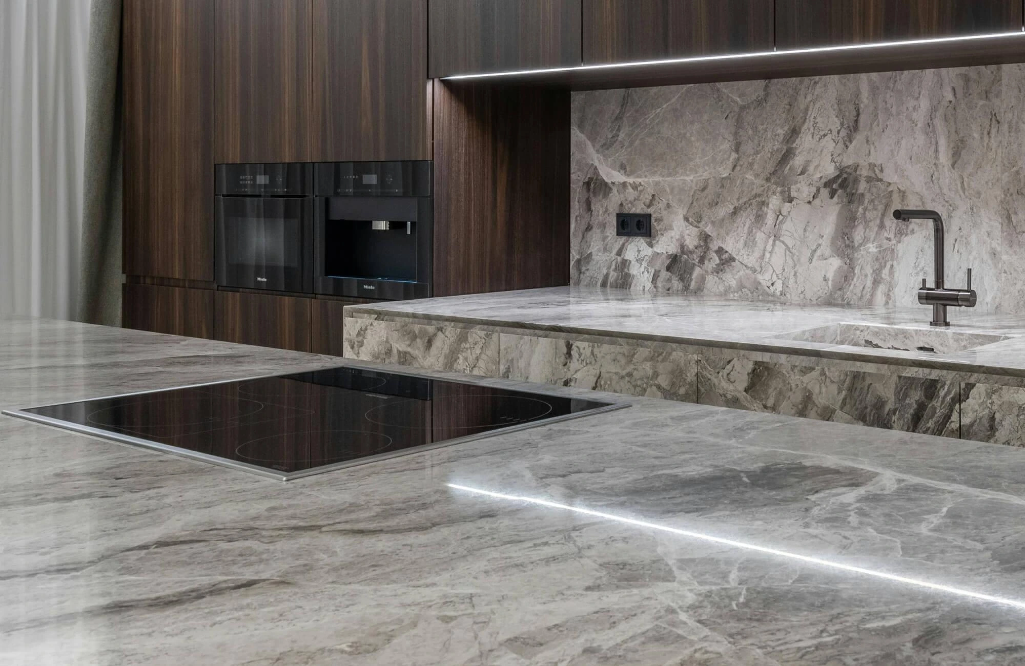 Modern grey veined marble slab design featured as a luxury Kitchen Countertop Material.
