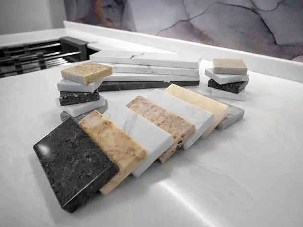 Stone and quartz material samples on display to evaluate Countertop Material Pros and Cons.