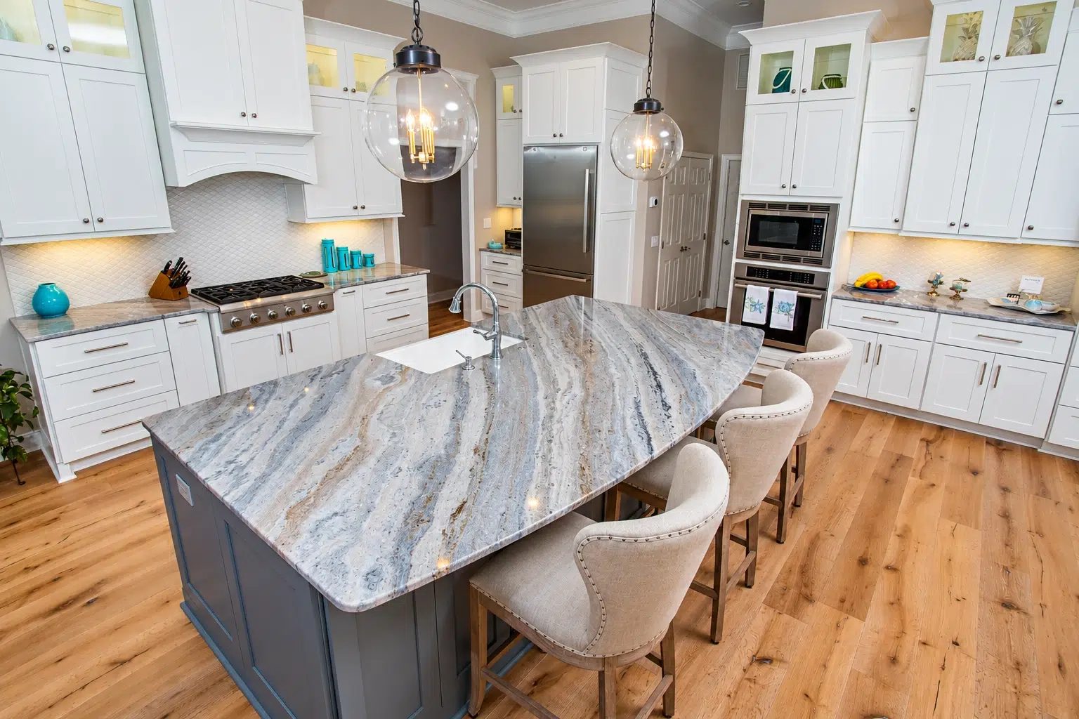 Quartzite island with rich veining installed for luxury countertops design.