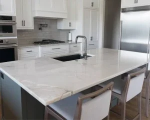 Elegant kitchen interior designed with Azzurra Bay Quartzite surfaces.