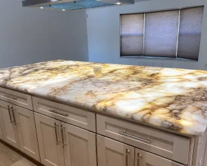 Glowing translucent onyx island featuring modern backlit stone countertops design.