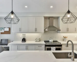 White modern kitchen with non-porous counter: Do You Need to Seal Quartz care guide.