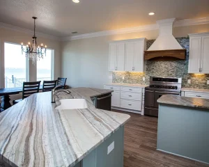 Modern kitchen with stone island featured in Keep Your Counters Looking New.