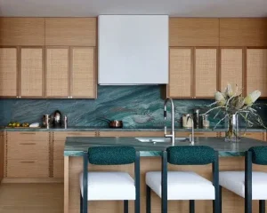 Modern wooden kitchen cabinetry paired with dark Trending Countertop Colors.
