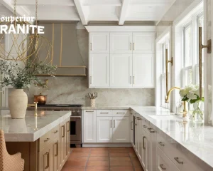 A white kitchen features elegant stone surfaces, showing how a high-quality Countertop Lasts Longer in Florida.