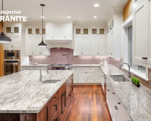 Modern kitchen featuring elegant white cabinetry and premium natural stone countertops for Pensacola homes.