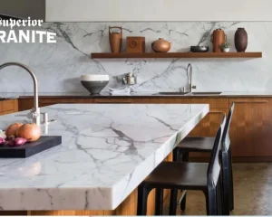Elegant kitchen with white veined counters and backsplash where Superior Granite Is Worth Money.