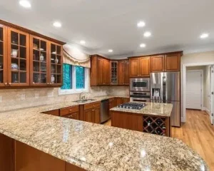 A modern wooden kitchen setup for homeowners shopping for new countertops.