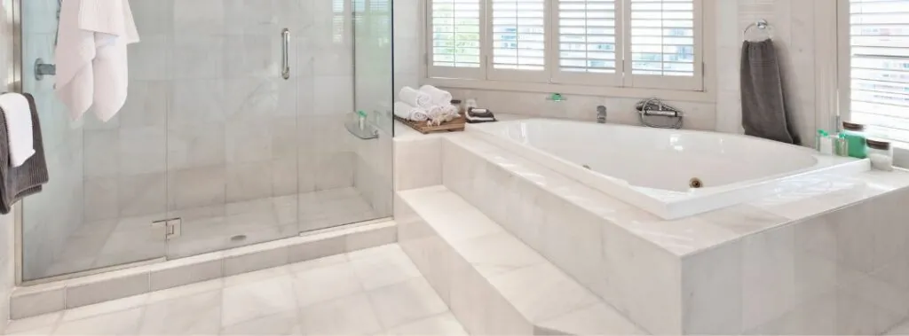 Spa-like Bathroom with Natural Stone Floor and Shower Tile