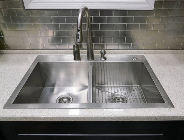 Double-bowl stainless steel drop-in basin showcasing standard Types of Kitchen Sinks.